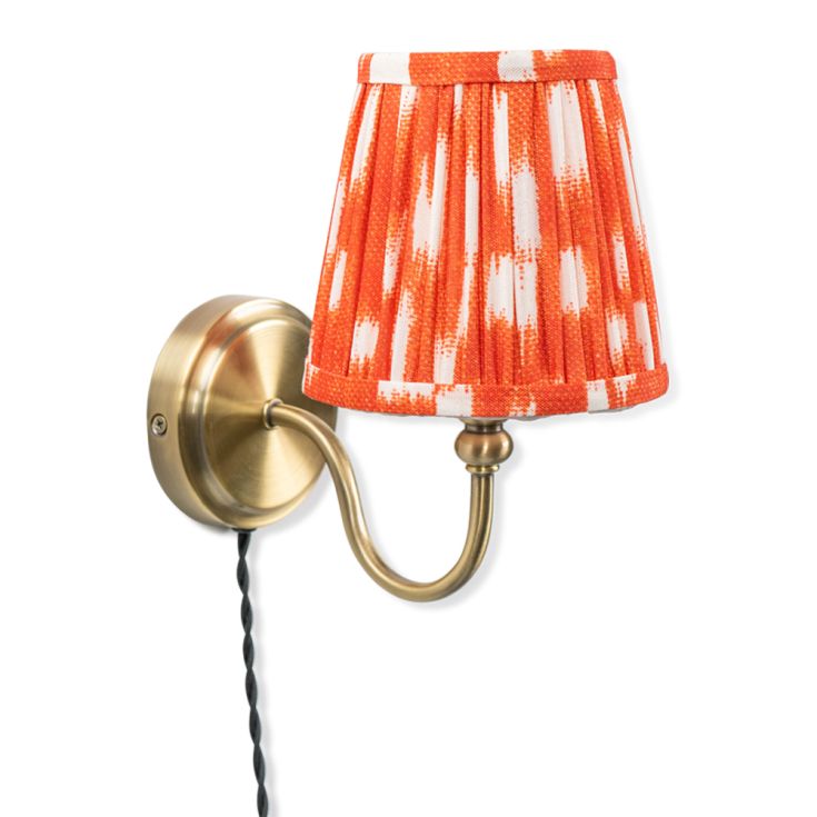 Neely Antique Brass Curved Plug In Wall Light with orange Pleated Shade