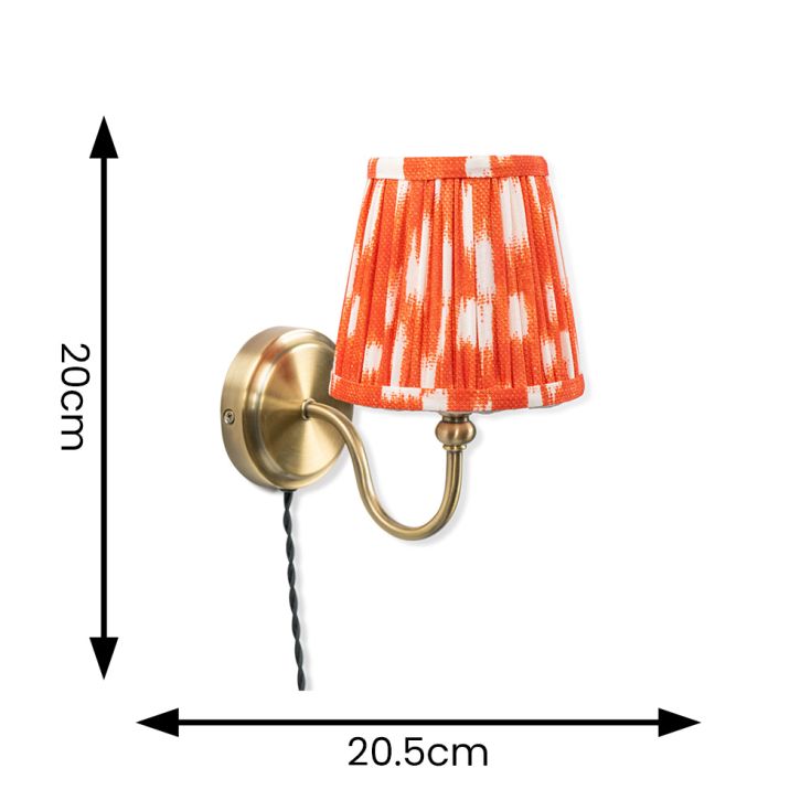 Neely Antique Brass Curved Plug In Wall Light with orange Pleated Shade