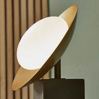 Gold & bronze dish table light with pebble shaped glass