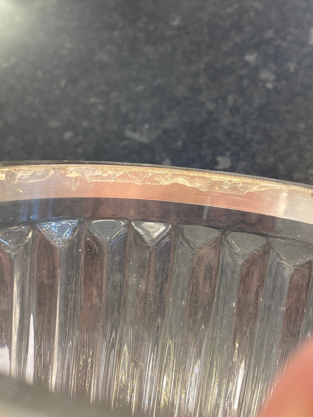 Close-up of a metal gear on a dark background