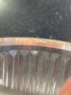 Close-up of a metal gear on a dark background