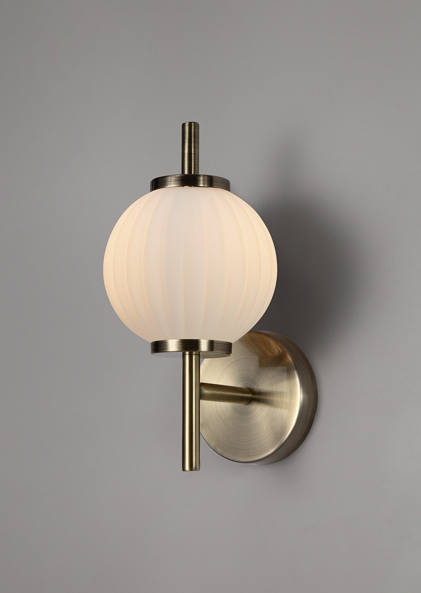 Lustre Segmented Glass Globe Wall Lamp In An Antique Brass Framework, 1 x G9